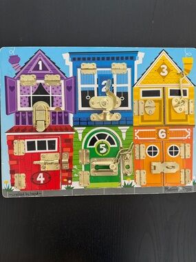 Melissa & Doug Rainbow Locks & Latches Activity Board